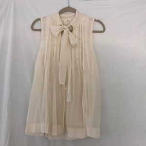 Ivory sleeveless tie-nick blouse